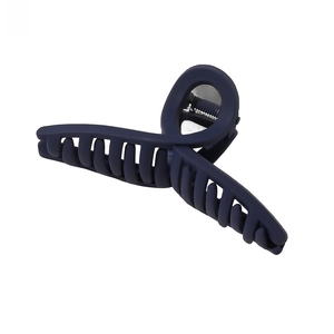 Detail view of large matte dark blue hair claw clip with strong interlaced teeth design