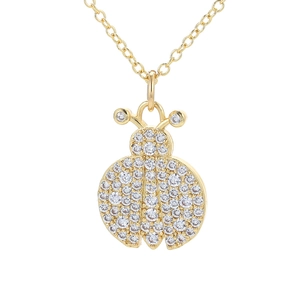 Golden ladybug necklace pendant with sparkling white zircon stones on white background