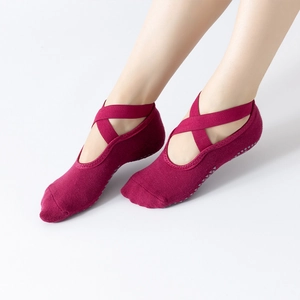 Non-slip yoga socks in burgundy with cross elastic straps and silicone grips