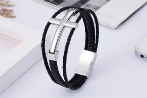 Close-up of multi-layer leather braided bracelet with polished stainless steel cross