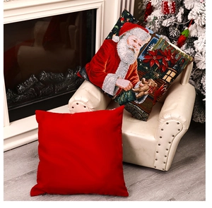 Christmas pillows with Santa Claus patterns on a white armchair by a cozy fireplace