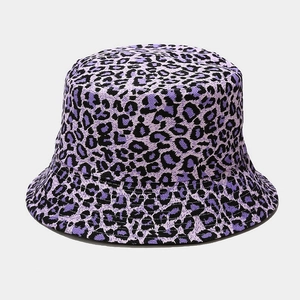 Detailed view of purple leopard print pattern on durable canvas bucket hat fabric