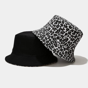 Double-sided reversible bucket hats in solid black and stylish leopard print patterns