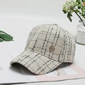 Chic tweed baseball cap in beige with black plaid pattern and gold M emblem