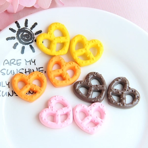 Miniature resin heart pretzels in assorted colors for DIY jewelry and crafts
