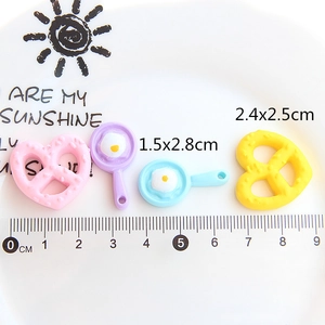 Miniature resin fried egg and heart cookie DIY accessories on a plate with scale ruler