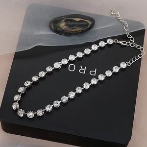 Detail of silver sparkling choker necklace with adjustable lobster clasp and clear crystals