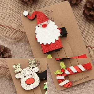 Detail display of glittery Santa, elk, and candy cane hair clips for Christmas styling