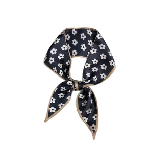 Dark blue satin scarf with white daisy floral print and gold edges tied in a bow