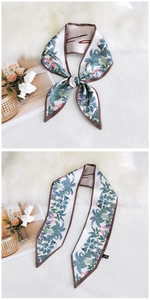 Detail of tropical flamingo print silk ribbon scarf made of 100% polyester fabric