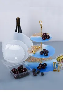 Detailed view of 3-tier wave-edged resin tray silicone molds with gold metal stand
