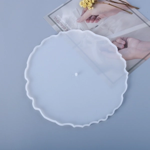 Detail of translucent round wave-edge silicone mold with center hole for DIY tray