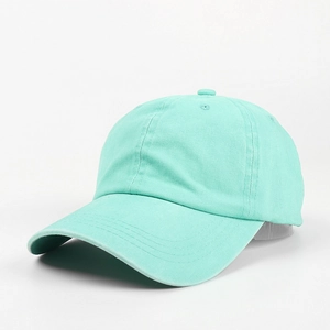 Detail view of the stitching and breathable eyelets on a mint green cotton baseball cap