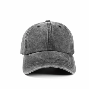 Close-up of vintage dark grey washed cotton baseball cap with distressed texture details