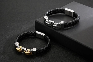 Detail of black braided leather bracelets with stainless steel magnetic clasps for men