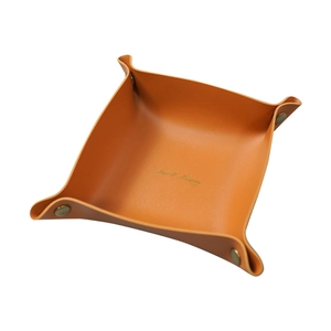 Minimalist orange leather desk tray with gold snaps for jewelry and key storage