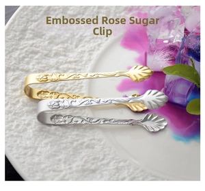 Detail of 304 stainless steel sugar tongs with embossed rose and shell-shaped head