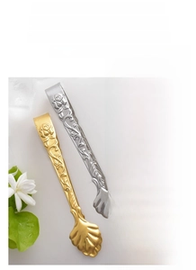 Macro shot of 304 stainless steel sugar tongs with embossed rose and shell-shaped head