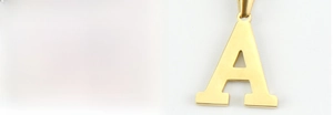 Close-up of 18k gold plated letter A pendant with sparkling diamonds and polished finish