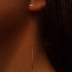 Elegant silver T-shaped tassel long drop ear threader jewelry for women worn by model