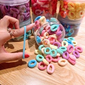 Close-up of soft colorful elastic hair bands being stretched to show high flexibility