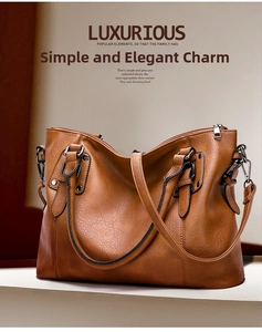 Detailed macro view of the brown leather bag texture and polished silver metal zipper