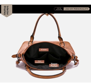 Detailed view of brown leather handbag interior with multiple compartments and lining