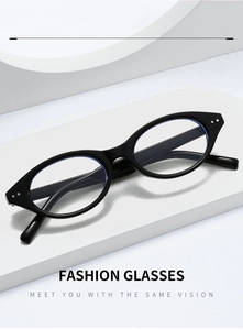 Macro view of black oval frame fashion glasses with metal rivets and blue light lens