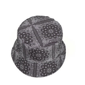Close-up detail of double-sided paisley print on a street style cotton bucket hat