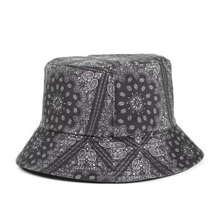 Detail of black paisley pattern on cotton fisherman hat showing intricate white prints