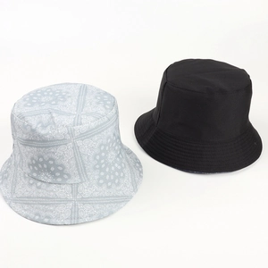 Detail of black and blue paisley reversible cotton bucket hat set with reinforced stitching