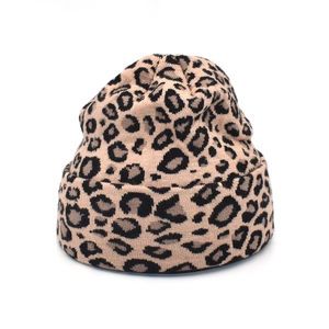 Close-up of leopard print knitted beanie showing leopard pattern and thick fold-up cuff detail