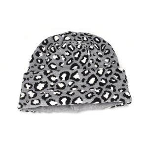 Close-up of the leopard print knit pattern and cuffed texture on this winter beanie