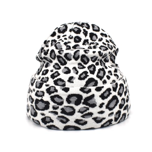 Detailed view of leopard print knit beanie texture with black white and grey patterns