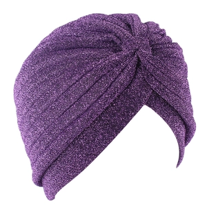 Detailed close-up of shiny purple turban featuring premium metallic silk pleated design