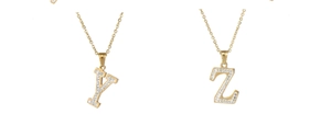 Detail of 18k gold plated stainless steel initial necklaces with Y and Z diamond pendants
