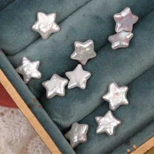 Lustrous star-shaped baroque freshwater pearls in a premium teal velvet jewelry tray