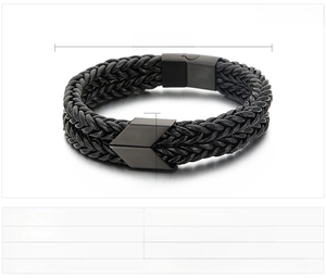 Detailed view of black braided leather bracelet with magnetic stainless steel arrow clasp