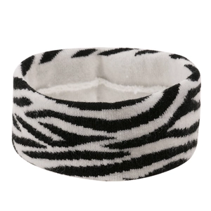 Detail of black and white zebra pattern knitted elastic headband with soft texture