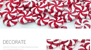 Close-up of red and white striped swirl candy ornament with festive decorative pattern