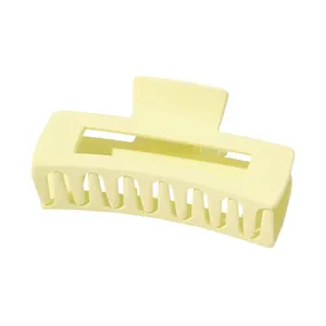 Matte cream large rectangle hair claw clip for thick hair shown at a 45-degree angle