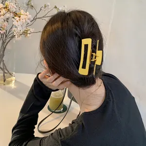 Matte bright yellow rectangular hollow hair claw clip for large hair volume