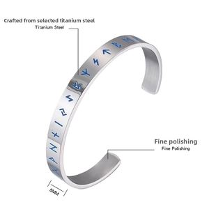 Detail showing 8mm silver titanium steel Viking bracelet with blue Runic engravings