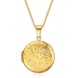 Golden round locket necklace with floral engraving and opening photo compartment