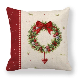 Macro view of Christmas wreath pattern with red bow on linen pillow cover