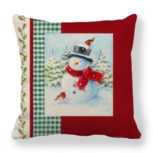 Close-up of linen Christmas pillowcase featuring a snowman with green plaid detail