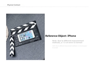 Detailed view of clapboard-style crossbody bag with phone for size reference