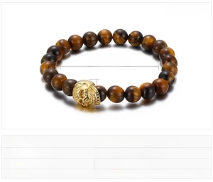 Tiger eye and black onyx beaded bracelet with golden stainless steel skull detail
