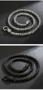 Detail of silver and black Byzantine chains featuring punk skull head clasp design