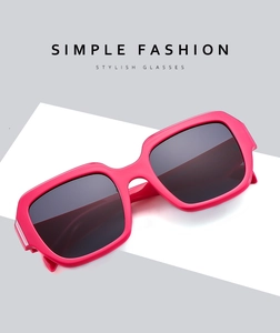 Detailed view of the bold pink rectangular frames and dark smoke lenses of the retro sunglasses